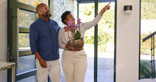 Preview: Couple, flowers and happy in new home or real estate with property investment, fresh start and supp