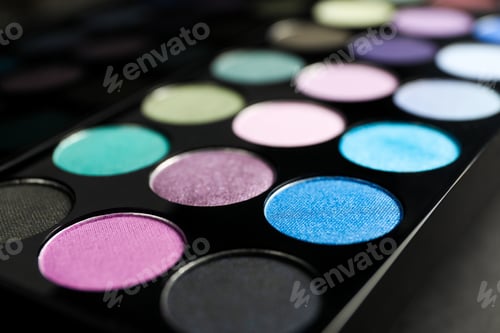 Preview: Colorful eyeshadow palette on grey background, closeup
