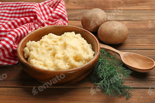 Preview: Bowl with tasty mashed potatoes on wooden table
