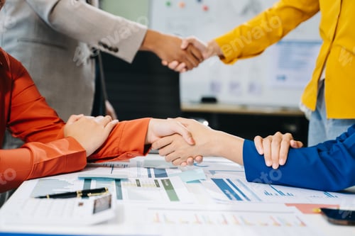 Preview: Two confident business man shaking hands during a meeting in the office, success, dealing