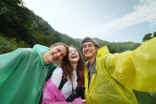 Preview: Young people taking selfie photo, having fun during the hiking in the forest