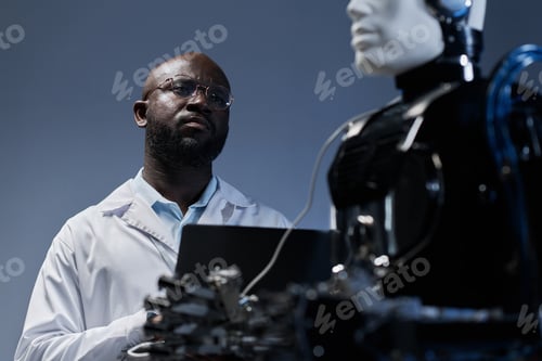 Preview: Engineer examining the artificial intelligence of robot