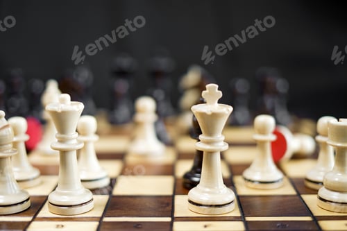 Preview: Chessboard and chess game. Competition between black and white, strategic intelligence board game.