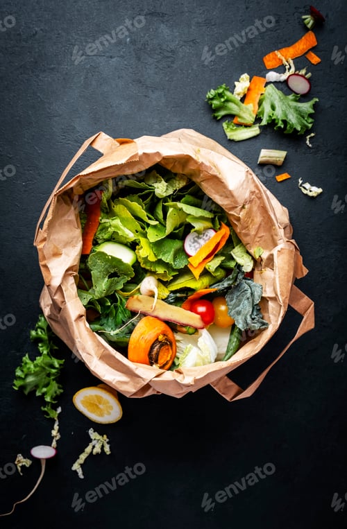 Preview: Zero waste concept. Food trash in recyclable paper bag for compost