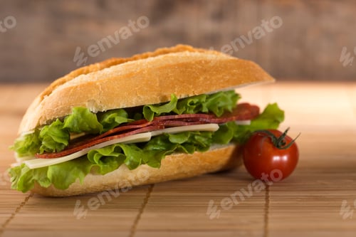 Preview: Sandwich with salami, cheese and lettuce