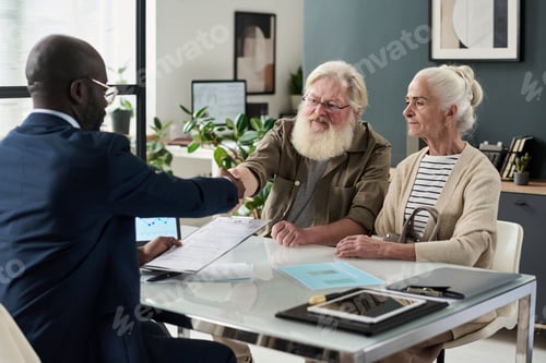 Preview: Financial Agent Shaking Hands With Senior Man