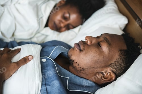 Preview: A couple sleeping in bed