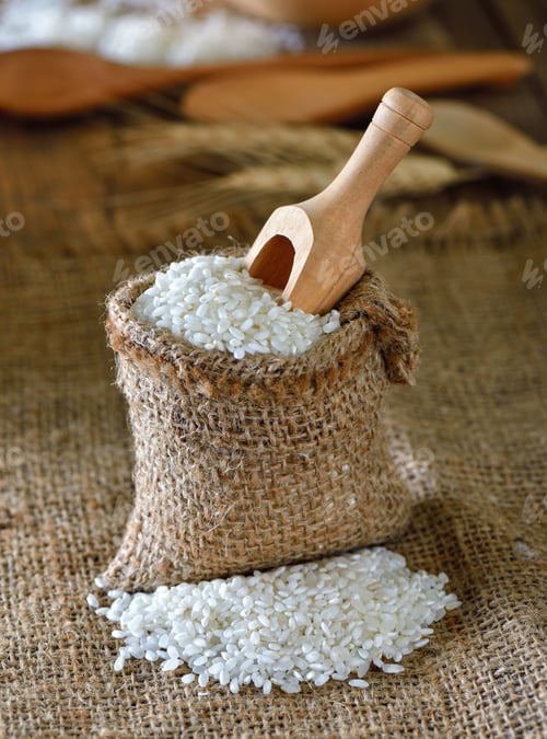 Rice Grains in a Burlap Bag with Scoop