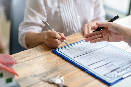 Preview: Businessman and woman discussing contract in office. Contracting and signing business investments