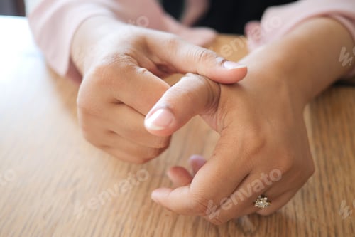 Preview: Young women hands suffering wrist pain,