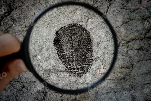 Preview: crime investigation, a magnifying glass and the fingerprint on the surface texture