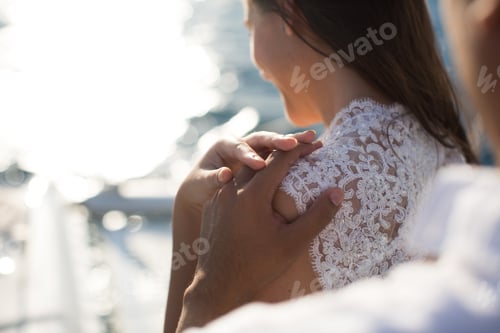 Preview: Wedding couple is hugging on a yacht. Beauty bride with groom