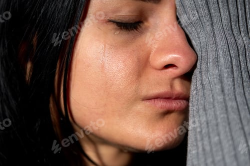 Preview: close up of unhappy crying woman