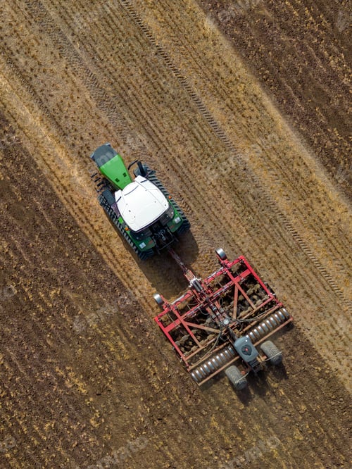 Preview: Aerial View - Farm Vehicle working on farmland