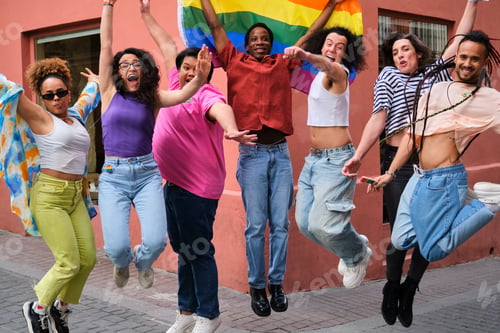 Preview: LGBTQ people are jumping up while holding a rainbow flag celebrating Pride Day.