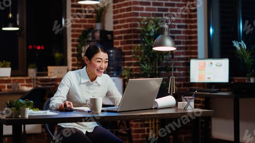 Preview: Employee receiving amazing news, throwing hands in air in celebration
