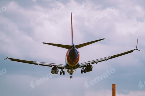 Preview: Beautiful view of an airplane flying in a cloudy sky