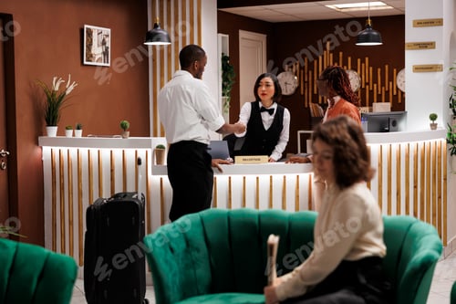 Preview: Employee giving access key card to man