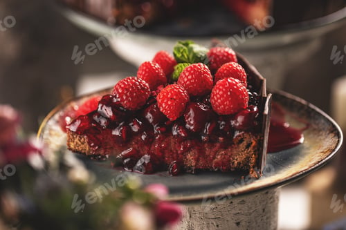 Vista previa: Slice of chocolate cake with cherry sauce