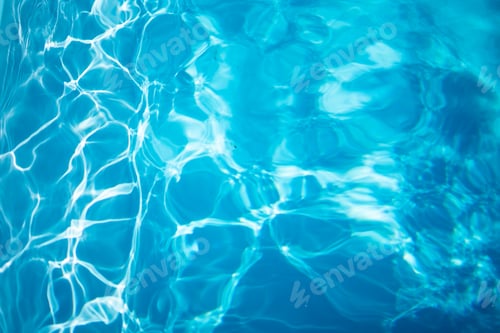 Preview: Sunlight creating beautiful patterns on the surface of water in swimming pool