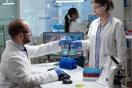 Preview: Microbiology team working at biochemistry experiment analyzing blood test