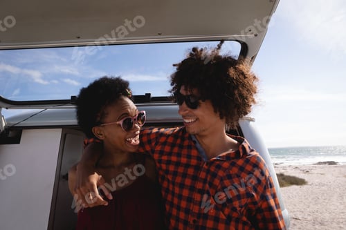 Preview: Couple interacting with each other at beach