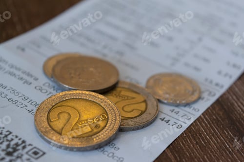 Preview: Georgian Lari coins on a receipt, inflation concept