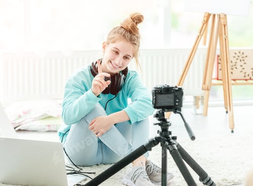 Preview: Happy teenage girl shooting vlog