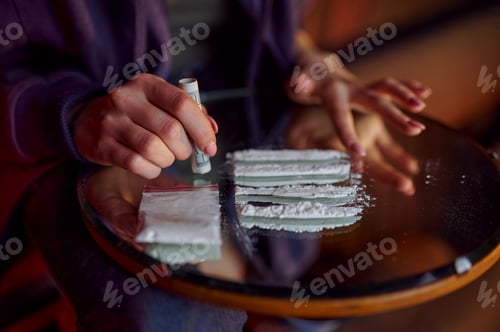Preview: Drug addict woman with powder prepares a dose