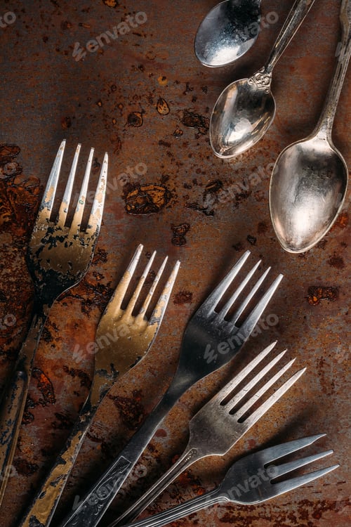 Preview: Vintage cutlery set on rusted background