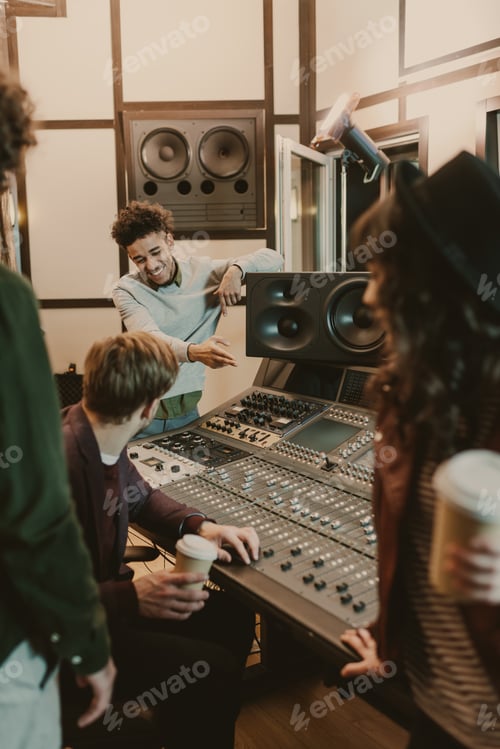 Preview: happy music band spending time at recording studio