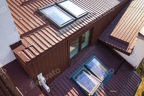 Preview: Aerial view of annex room exterior with plastic attic windows, roof and walls covered with brown