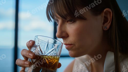 Preview: Tired businesswoman drink alcohol closeup. Depressed brunette overworking alone