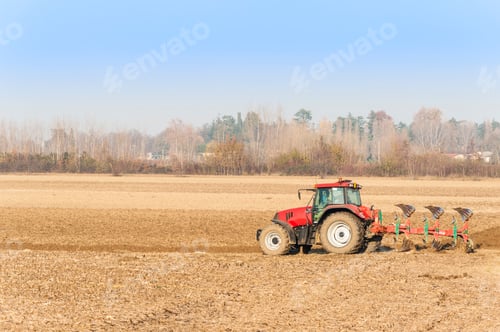 Preview: Red Tractor Plowing in Autumn.