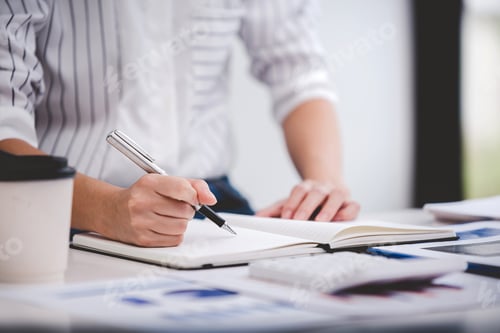 Preview: business woman work in the business office on the desk