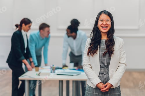 Preview: Portrait of a an asian businesswoman posing during a meeting in the office
