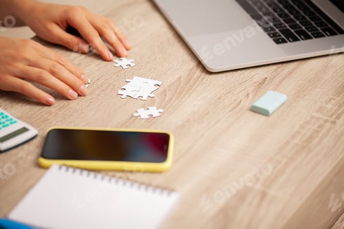Preview: Business success concept, woman makes up puzzle