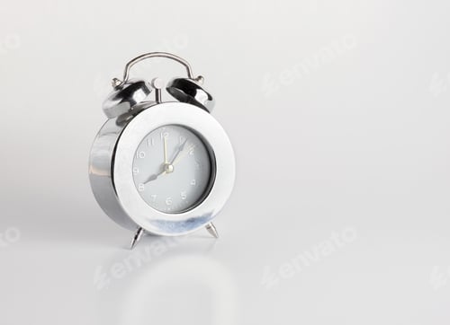 Preview: sliver alarm clock on gery background