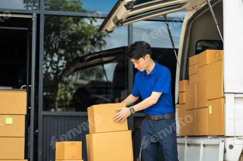Preview: Asian delivery man work in truck for checking the product in the truck, concept ecommerce.