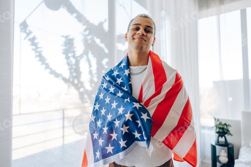 Preview: Proud man holding the American flag on sunny day. Concept of patriotism, 4th of July celebration