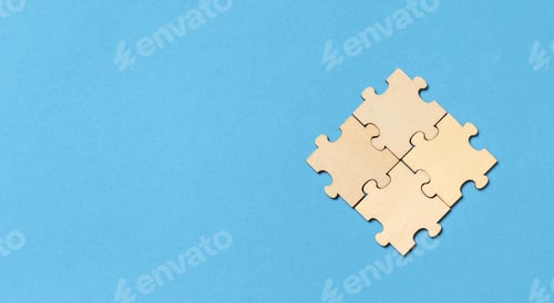 Preview: Teamwork and Business Solution Concept with Four Connected Puzzle Pieces