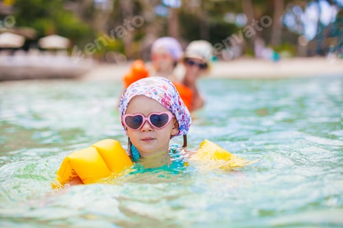 Preview: Cute little girl at beach during summer vacation