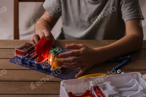 Preview: Child boy collects electronic constructor. Educational toys. Development of preschool children