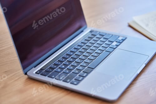 Preview: Self-educate and innovate. Shot of a laptop on a desk in an empty office during the day.