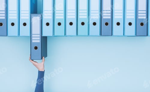 Preview: Office worker taking a folder in the archive