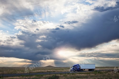Preview: Commercial truck driving through the high desert country of eastern Washington, USA