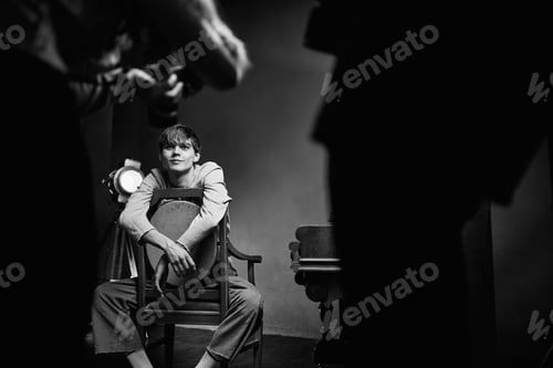 Preview: guy sitting on a chair next to the piano posing photo