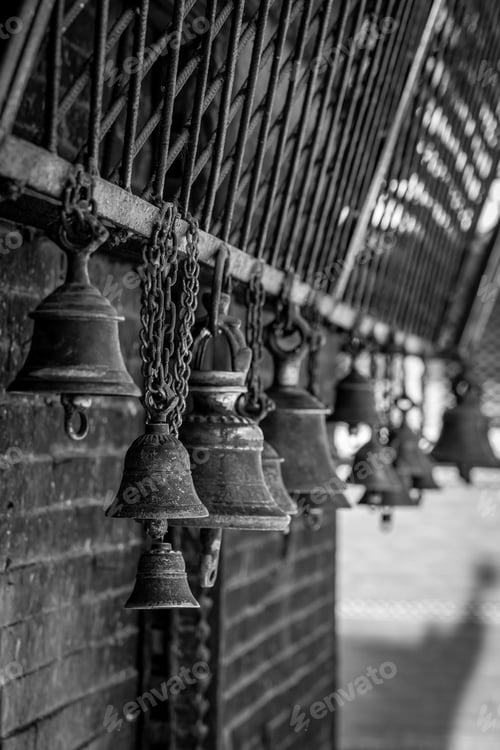 Preview: Grayscale shot of hanging bells