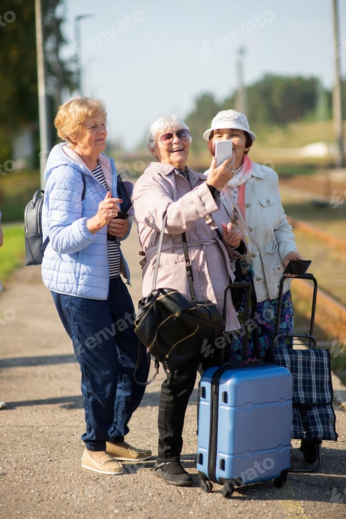 Preview: Senior Women Take Photo at the Train Station