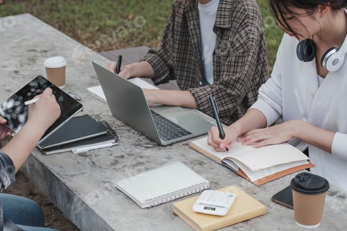 Preview: Group of Student working on laptop and record in book together at university. Happy friend